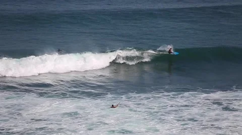 The surfers and waves, marine elements Beach, Uluwatu, Bali, Indonesia. Stock Footage 66579810