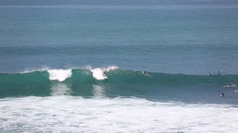 The surfers and waves, marine elements Beach, Uluwatu, Bali, Indonesia. Stock Footage 66592657