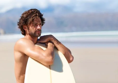 A surfers anticipation. Cropped image of a young man from the chest up. Stock Photos