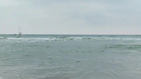 Surfers are floating on water in lumpy sea. Stock Footage 36078120
