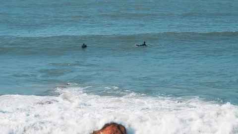 Surfers on Atlantic ocean wave 動画素材 104666855