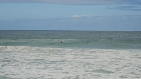 Surfers at the beach catching waves Trigg beach Perth Stock Footage 107587296
