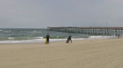 Surfers on beach Stock Footage 38058880