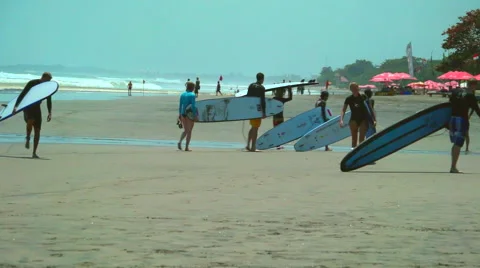 Surfers on Beach Stock Footage 49408212
