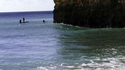 Surfers at the beach Stock Footage 85562832