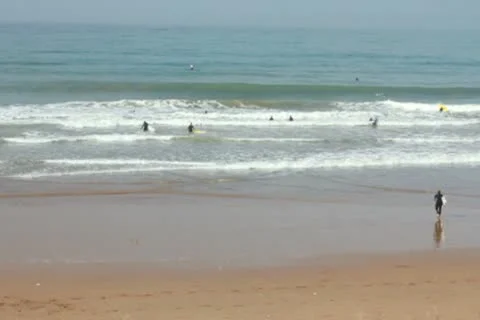 Surfers beach, pan shot, slow motion 스톡 동영상 10793372