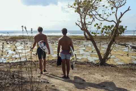 Surfers at the beach Fotos de archivo