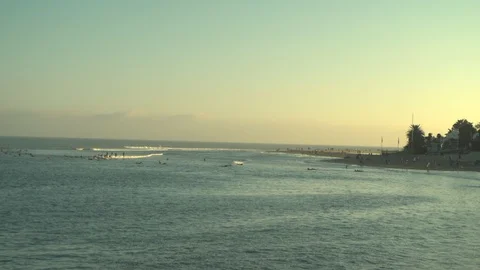 Surfers on beach in sunset Stock Footage 125807238