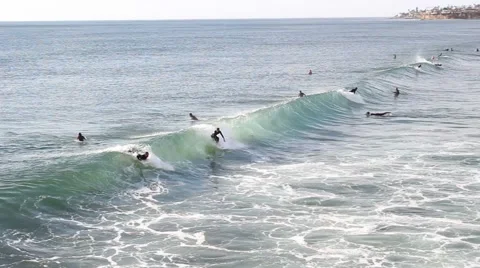 Surfers carving a wave. Stock Footage