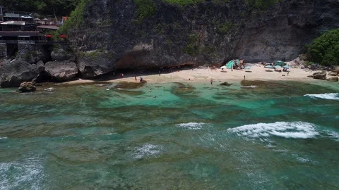 Surfers catch and ride the wave on reef. Turquoise ocean and the waves crashing Video stock 88229947