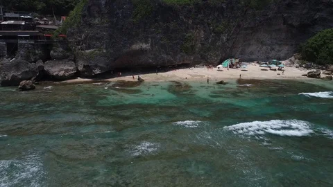 Surfers catch and ride the wave on reef. Turquoise ocean and the waves crashing Video stock 88229999