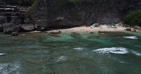 Surfers catch and ride the wave on reef. Turquoise ocean and the waves crashing Video stock 88230018