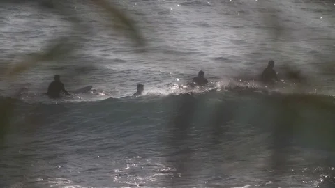 Surfers catch waves, slo-mo. Stock Footage 82330687