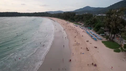 Surfers catch waves at sunset. The view from drone Video stock 186747049