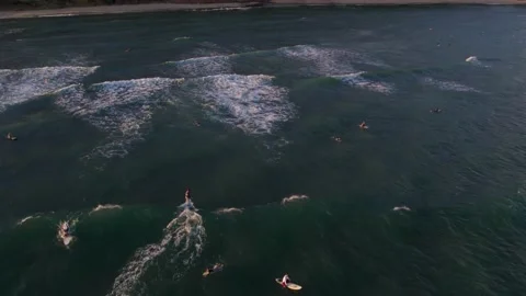 Surfers Catching Sunset Waves on Oahu, Hawaii Stock Footage 170903261