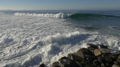 Surfers catching waves and riding down the line Video stock 77610397
