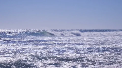 Surfers catching waves at the beach 4k Stock Footage 105996972
