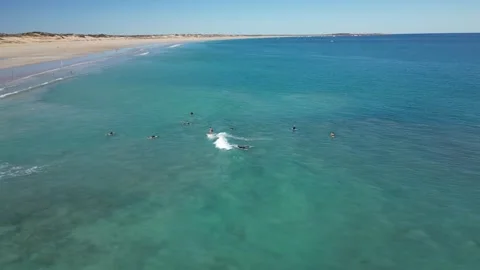 Surfers Catching Waves Breaking Over White Sand Cable Beach Broome WA Vidéo 276430235