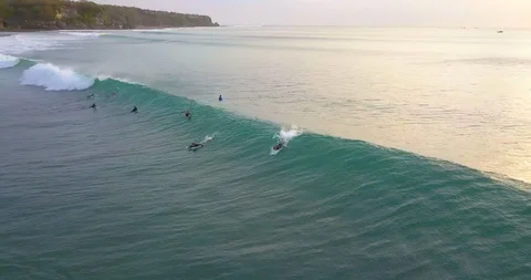 Surfers catching the waves Stock Footage 96005584