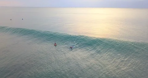 Surfers catching the waves Stock Footage 96006876