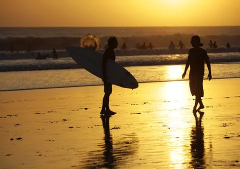 Surfers on a coastline Stock Photos