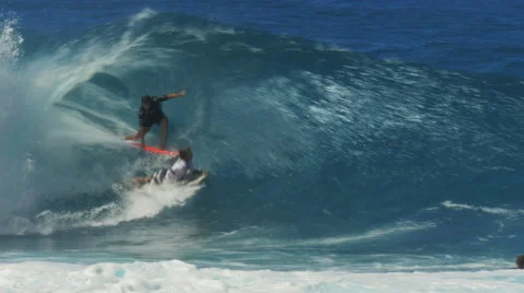 Surfers collide at pipeline Stock Footage 47223128