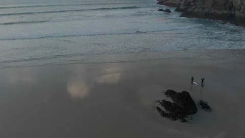Surfers in Cornwall during sunset Drone Stock Footage 151332570