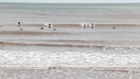Surfers in Devon Stock Footage 135083176