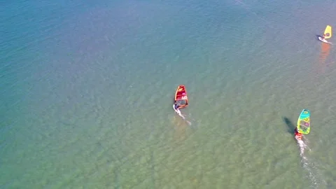 Surfers doing windsurfing at Turkey's world famous Cesme Alacati Beach 動画素材 240853462