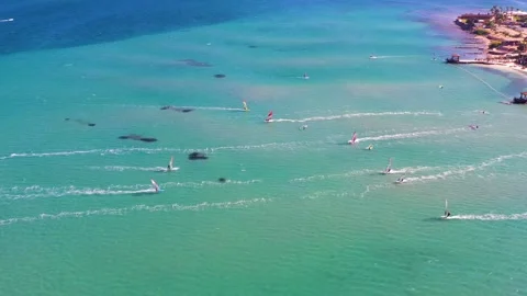 Surfers doing windsurfing at Turkey's world famous Cesme Alacati Beach Video stock 240853980