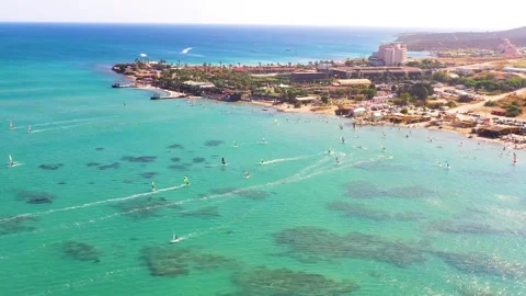 Surfers doing windsurfing at Turkey's world famous Cesme Alacati Beach 動画素材 240854128