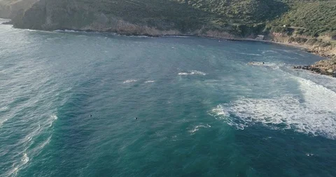 Surfers duck diving under a wave Stock Footage 112057244