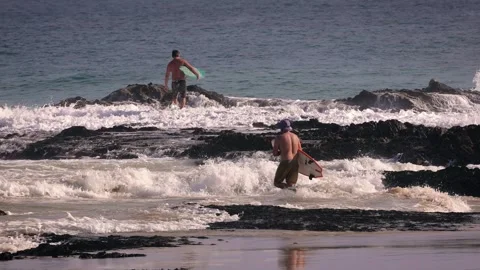 Surfers enjoying large waves during a morning surfing session at Snapper Rocks. Stock Footage 327531516