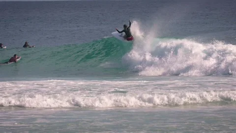 Surfers enjoying large waves during a morning surfing session at Snapper Rocks. Stock Footage 327531799