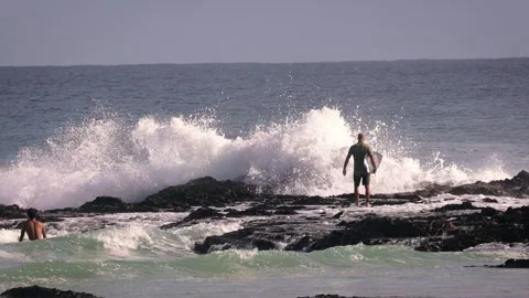 Surfers enjoying large waves during a morning surfing session at Snapper Rocks. Video stock 327532413
