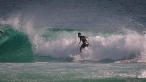 Surfers enjoying large waves during a morning surfing session at Snapper Rocks. Stock Footage 327532649