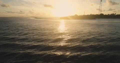 Surfers Floating In The Ocean During Sunset Drone shot scene Calm Stock Footage 90021052