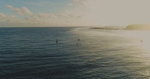 Surfers Floating In The Ocean During Sunset Drone shot scene Calm Stock Footage 90021206