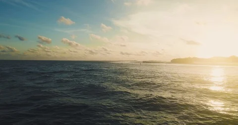 Surfers Floating In The Ocean During Sunset Drone shot scene Calm Stock Footage 90021226