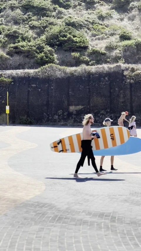 Surfers getting ready on Ribeira d Ilhas beach Ericeira Stock Footage 304883160