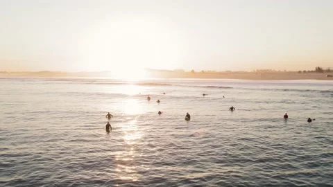 Surfers at golden hour Video stock 184079934