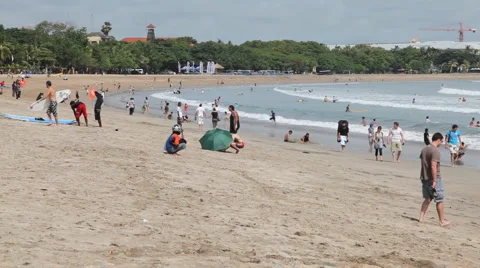 Surfers on the Kuta beach  Stock Footage 1102236