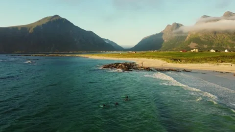 Surfers in Lofoten, midnight sun. Stock Footage 249246084