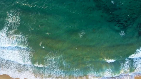 Surfers in the ocean aerial view Stock Footage 122307903