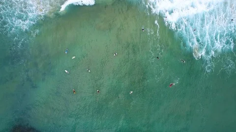 Surfers in the ocean aerial view Stock Footage 122308043