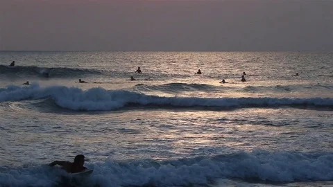 Surfers in the ocean Stock Footage 72474613