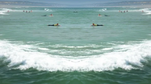 Surfers In Ocean Mirror Effect Background Stock Footage 100072217