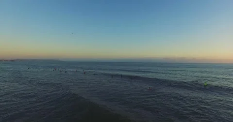 Surfers in Pacific Ocean - 4K Stock Footage 54179935