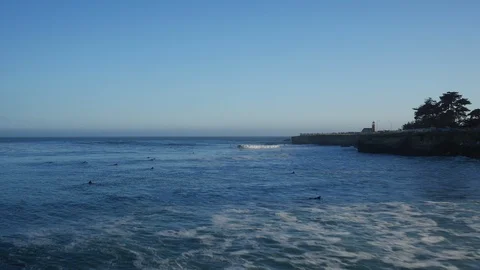 Surfers paddling to waves Stock Footage 85919178