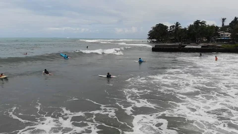 Surfers at playa negra Stock Footage 127256128